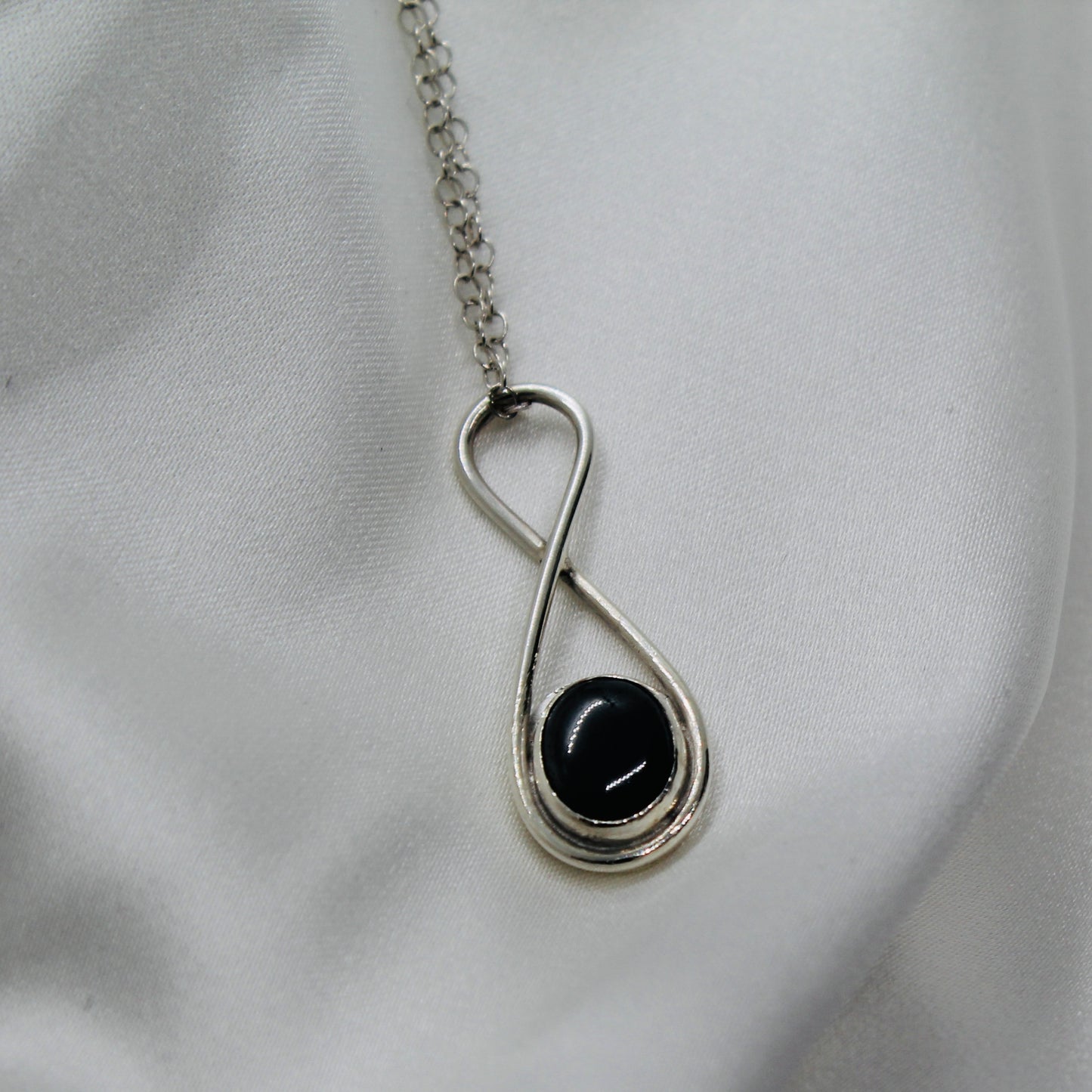 Hematite infinity pendant