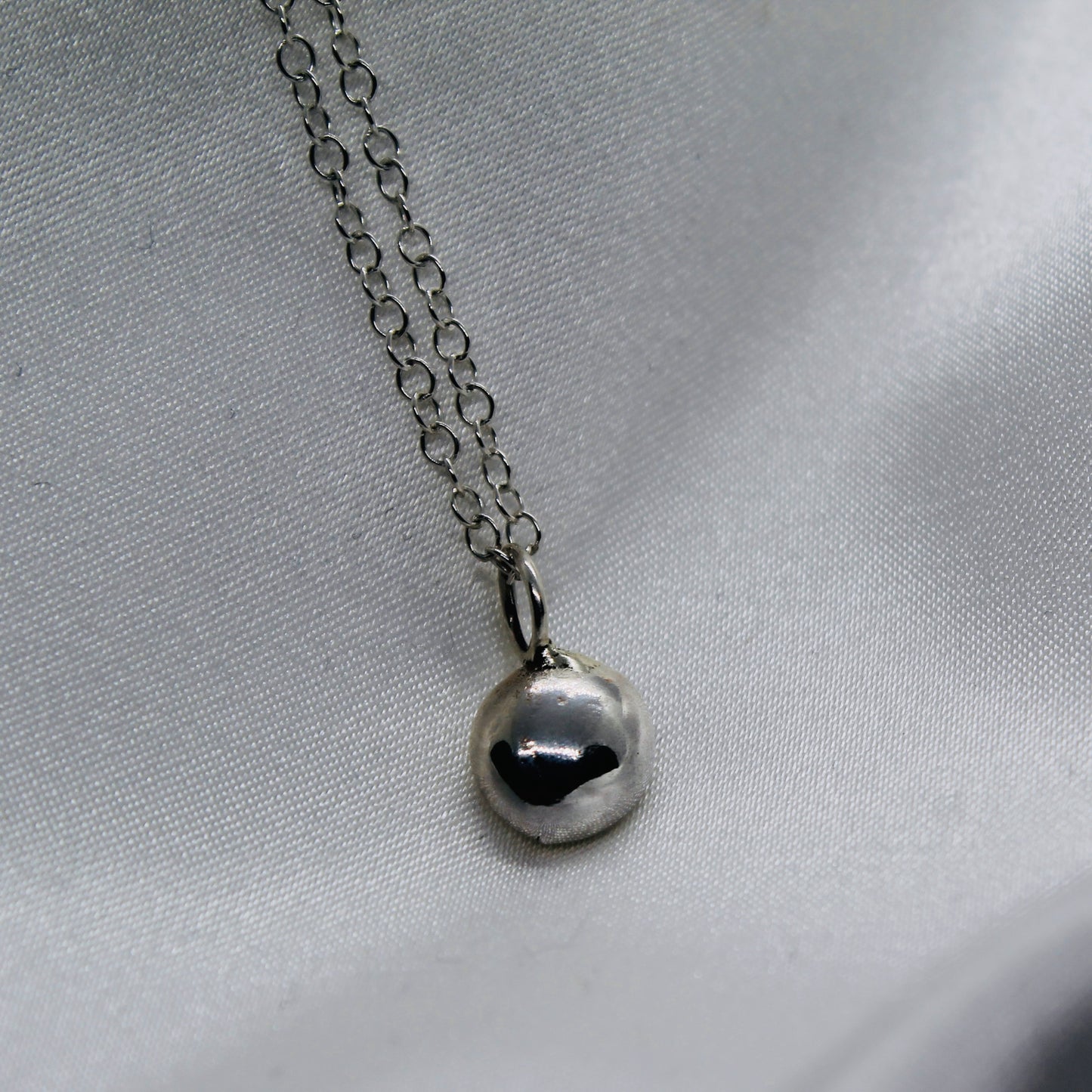 Double sided ‘molten silver’ pendant